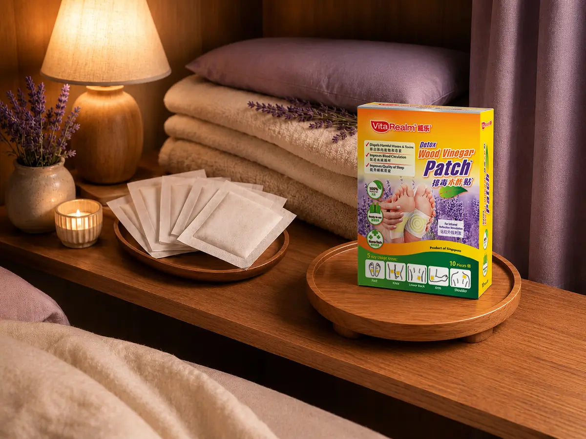 VitaRealm Detox Wood Vinegar Patch box on a wooden tray with unused foot patches and lavender