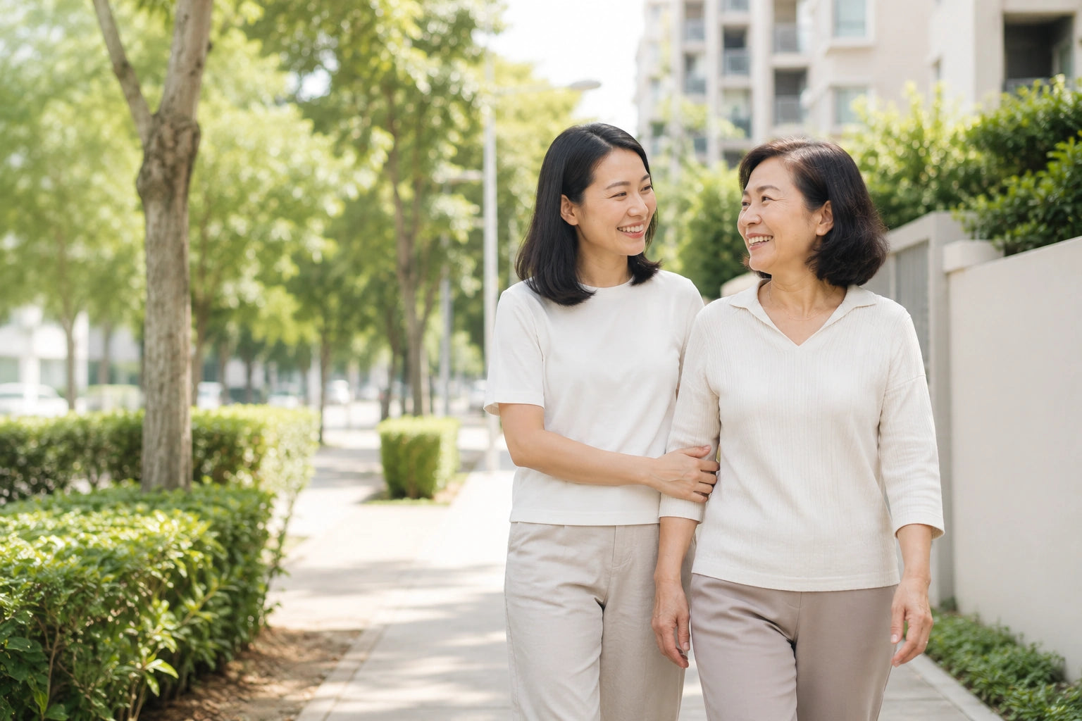 Singaporean daughter walking with her mother outdoors